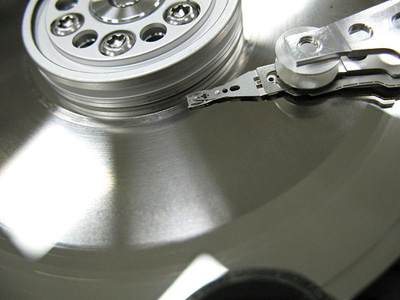 This is a close up picture of the Read-Write Head floating over a healthy Hard Disk Platter.